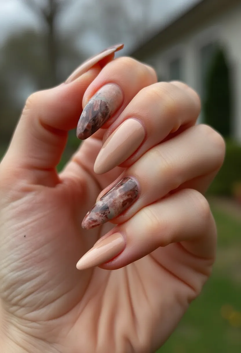 The nail design features an elegant palette of neutral tones, with a combination of soft beige and intricate marbled patterns in shades of brown, grey, and cream. The nails are almond-shaped, delivering a sophisticated and stylish appearance. The marbled effect, resembling natural stone, adds a touch of uniqueness and artistic flair to the design. The use of gel nails is apparent due to the high-shine finish and durability. This design might be suited for the autumn season, given the earthy tones, or any special occasion where a classy yet distinctive look is desired. The combination of solid color and marbled patterns creates a balanced, eye-catching aesthetic.