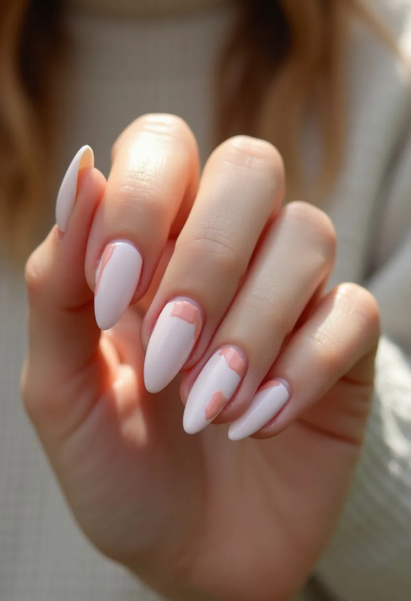 The nail design showcases a soft pastel pink color palette, featuring long almond-shaped nails. Each nail is adorned with a minimalistic yet intricate pattern that includes geometric cut-out shapes near the cuticles, revealing the natural nail underneath. The design appears to be clean and elegant, suggesting a gel treatment due to its glossy and well-finished appearance. The overall aesthetic is sophisticated and could be suitable for both everyday wear and special occasions, subtly tying into a modern and chic seasonal theme, potentially spring due to its light and airy color scheme.