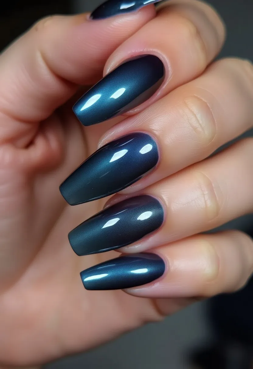 The nail design showcases medium-length, coffin-shaped nails treated with a gel application, denoted by their smooth, glossy finish. The color palette features a captivating deep metallic blue, which gives off an iridescent sheen that shifts in lighting, adding to its elegant appeal. There are no intricate patterns or additional decorations on the nails, allowing the rich, sophisticated hue to stand out prominently. The sleek, mirror-like surface of the gel treatment further enhances the chic appearance, making this design suitable for a variety of settings, from daily wear to special occasions, particularly during the autumn and winter seasons.