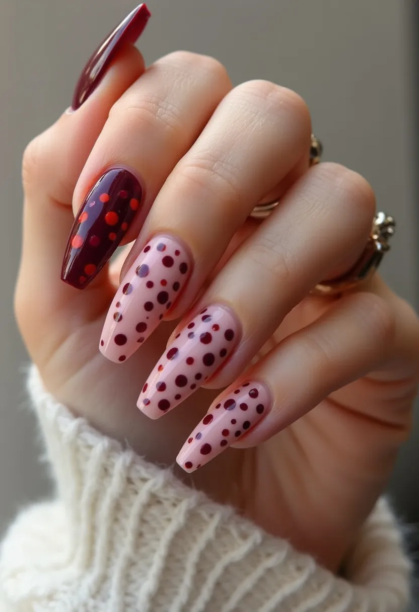 This nail design features long, almond-shaped nails with an eye-catching polka dot pattern. The color palette includes deep plum, light pink, and a touch of bright red. The thumb and ring fingers present a solid deep plum base adorned with red and pink polka dots, while the other nails showcase a light pink base with an array of plum and red polka dots of varying sizes. The nails appear to have a glossy finish, indicative of a possible gel or shellac treatment. The design's playful yet sophisticated color scheme and pattern could be suitable for seasonal transitions such as autumn or special events like a festive gathering.