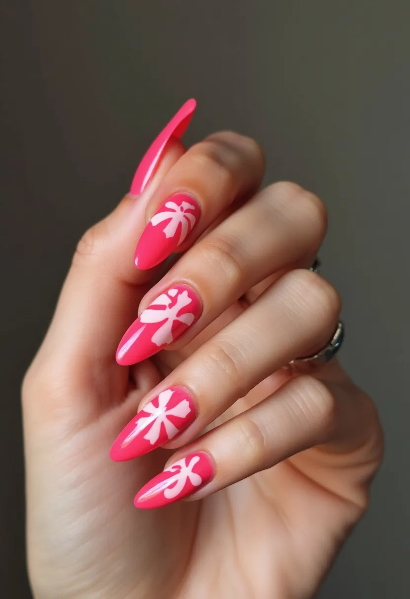 The nail design showcases a vibrant pink color palette with a glossy finish, likely achieved using gel polish due to its intense shine and smooth texture. The nails are shaped into a long stiletto style, emphasizing an elegant and striking appearance. Intricately painted white tropical palm trees adorn the nails, adding an eye-catching contrast against the bold pink background. This design suggests a summery theme, suitable for warm weather or beach vacations, and its bright colors and playful patterns make it perfect for festive occasions or casual summer outings. The overall look is both stylish and fun, making a bold statement.