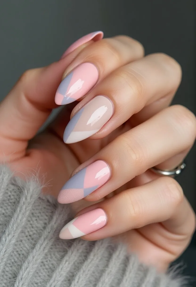 The nail design showcases a soft and elegant palette featuring pastel pink, light nude, white, and light blue colors. The nails are shaped into a medium-length almond form, which adds to their sophisticated appearance. Each nail is decorated with an intricate geometric pattern, combining diagonal blocks of color that create a harmonious, almost plaid-like effect. The glossy finish suggests a gel or shellac treatment, adding a shiny and smooth texture to the nails. This design is subtly chic and seems perfect for a spring or early summer theme, complementing light and airy outfits. The careful coordination of colors and precise execution of the patterns reflect a modern yet timeless aesthetic.