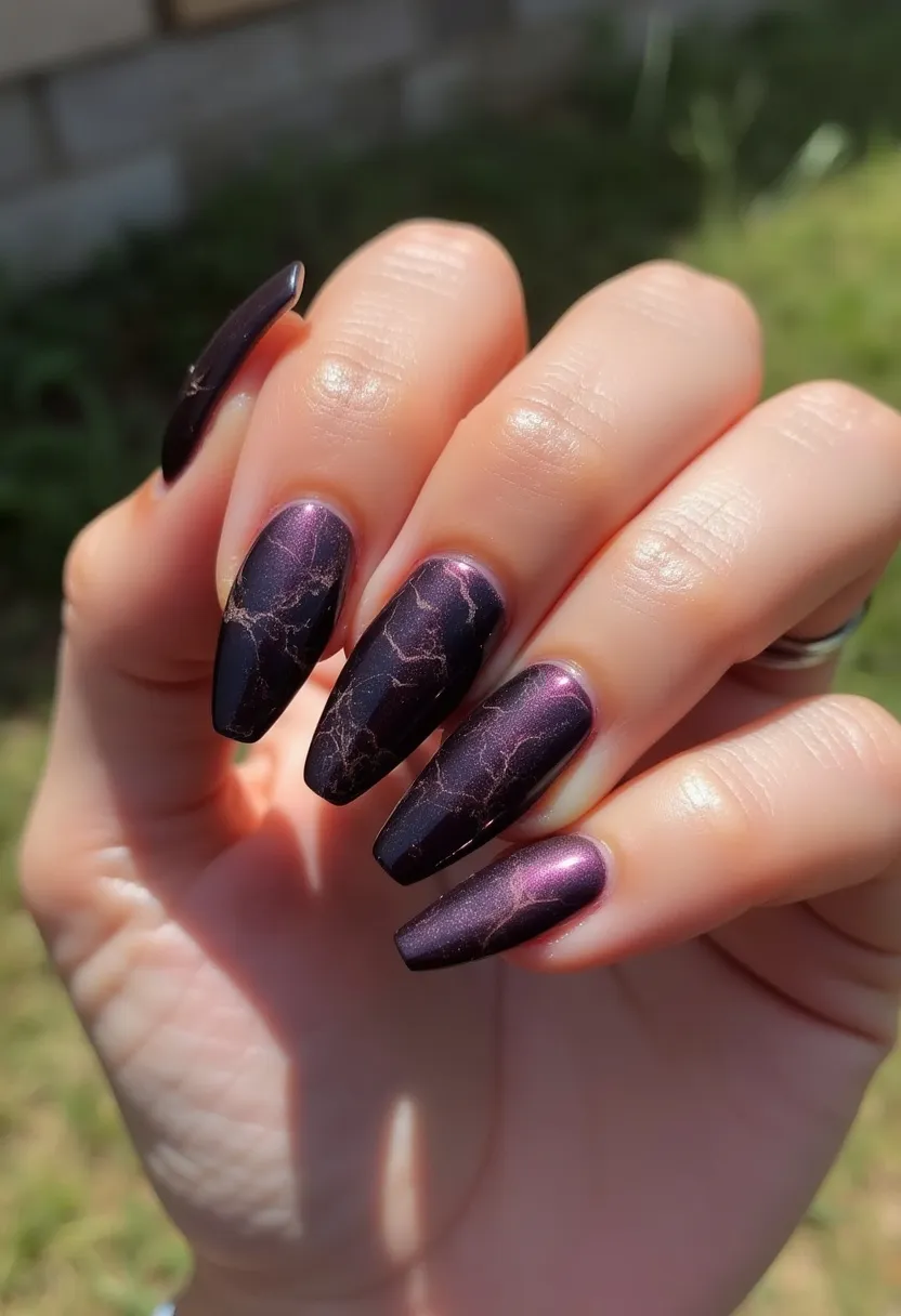 The nail design features a rich, dark purple color palette with metallic undertones, creating a striking and luxurious look. The nails are long and coffin-shaped, providing an elegant and sophisticated appearance. They are adorned with a marbled pattern, using delicate and intricate lines in a contrasting gold color, adding a touch of elegance and complexity. This design appears to be achieved using gel polish, known for its durability and high-gloss finish. The combination of dark colors and metallic accents makes this design particularly suitable for the autumn or winter season, while the intricate marbling adds an artistic flair, making it ideal for special occasions or formal events.