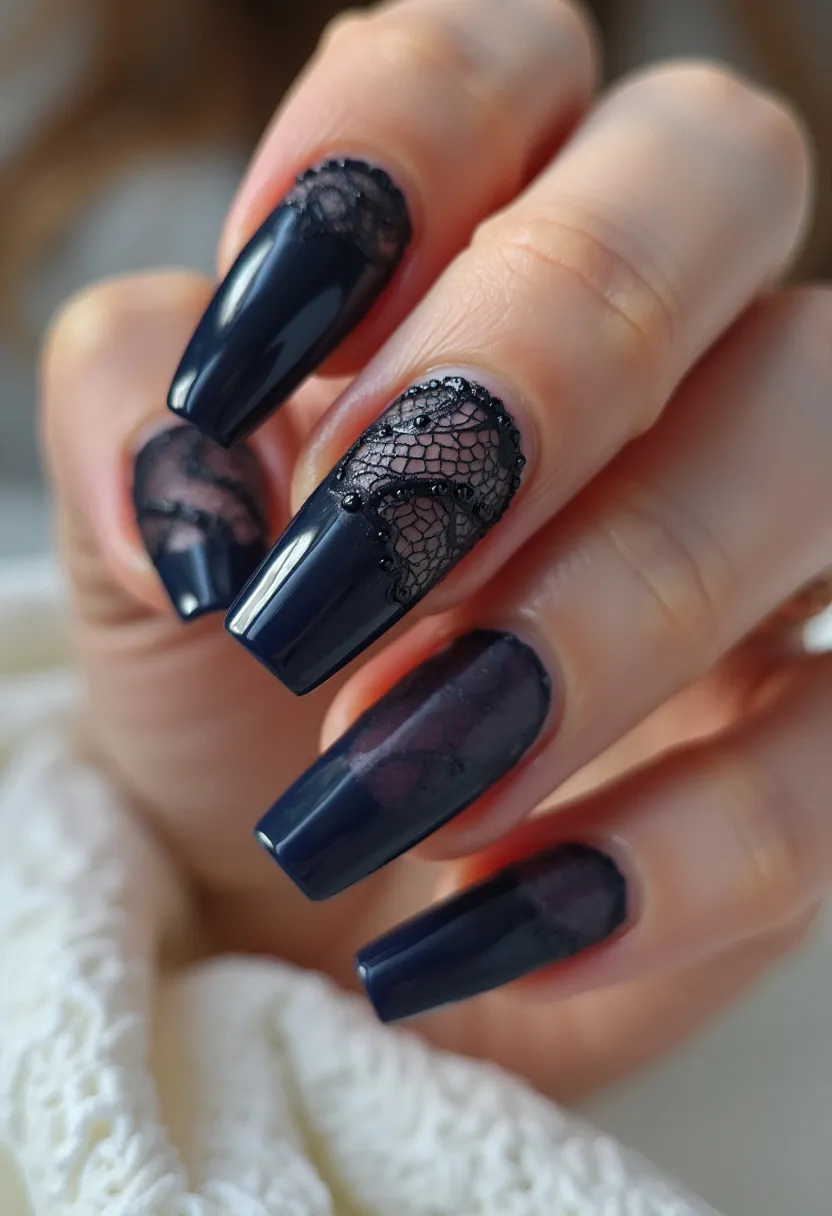 The nail design features a deep navy blue color palette and is executed on long, coffin-shaped nails. The nails appear to be done using a gel treatment, as suggested by the high-gloss finish. Intricate black lace patterns decorate some of the nails, adding an elegant and sophisticated touch. Small black beads accentuate the lace detailing, providing a 3D effect that enhances the overall design. The combination of the dark color and lace detailing is reminiscent of a formal or evening theme, making it perfect for special occasions. The design is striking and chic, likely aimed at making a bold fashion statement.