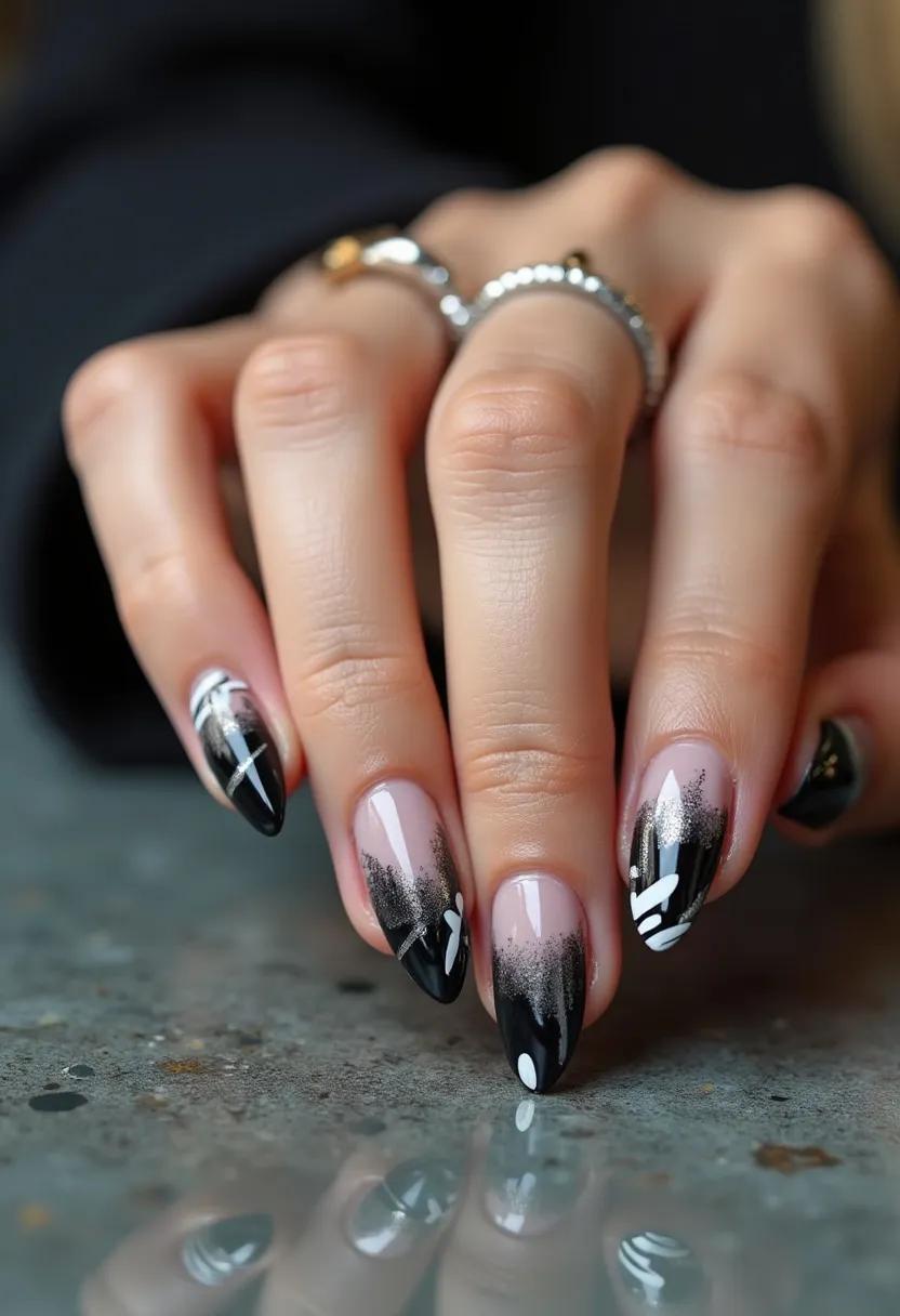 The nail design showcases a chic and sophisticated aesthetic with an almond shape. The color palette prominently features a combination of black, white, and silver hues. The design transitions from a natural-looking base near the cuticles to a deep black gradient towards the tips. Intricate patterns, including white and silver lines and abstract shapes, add a modern touch to the nails. The nails appear to have a glossy finish, suggesting a gel treatment, which enhances the vibrancy and durability of the design. This nail art could be suitable for evenings, formal events, or even seasonal themes such as Halloween, providing a stylish and eye-catching look.