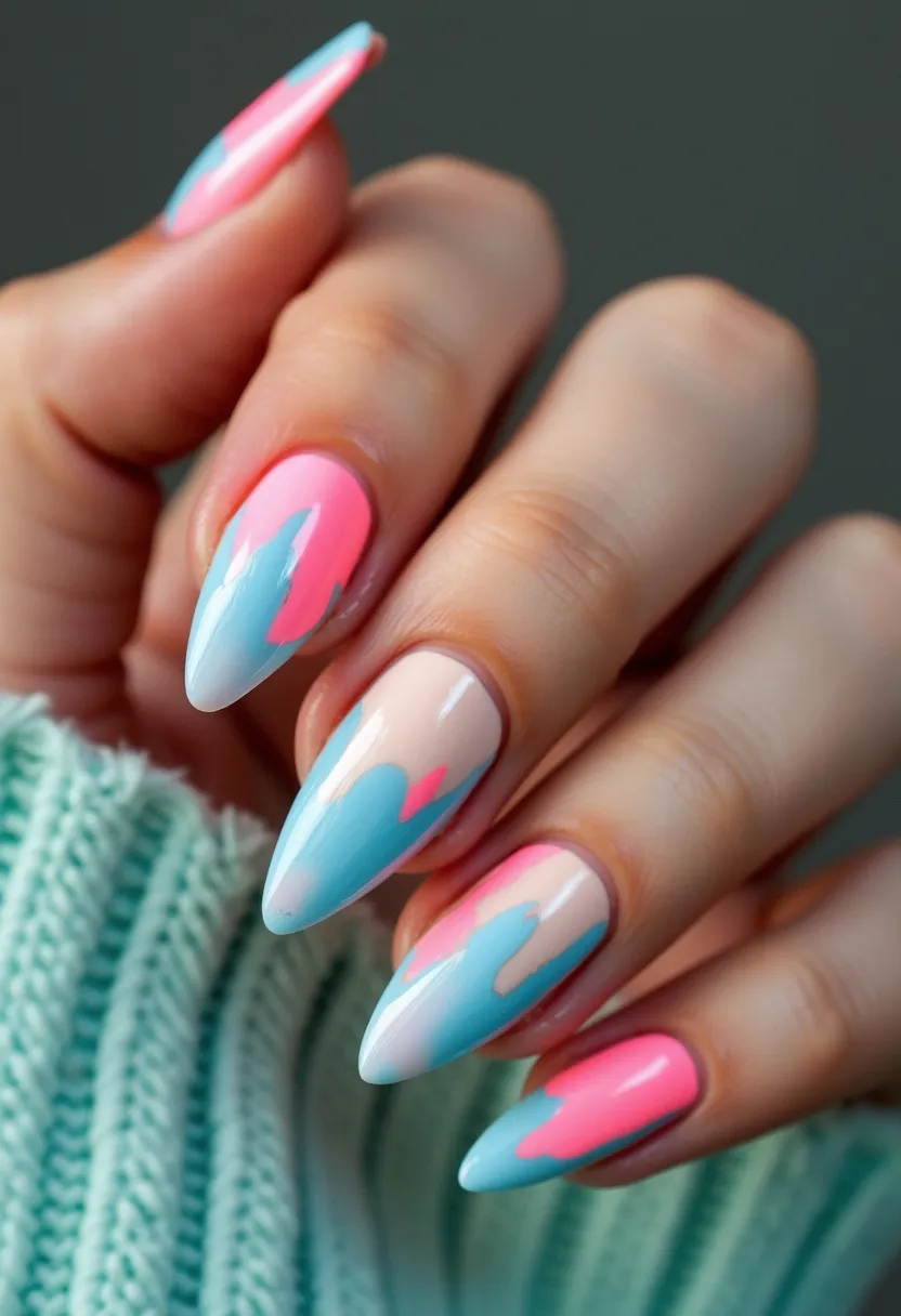 The nail design features a vibrant color palette consisting of pastel pink, sky blue, and a nude base. The nails are fashioned into an elegant almond shape, creating a sophisticated yet playful appearance. Intricate patterns include abstract splashes and drips of blue and pink over the nude base, blending seamlessly to give a dynamic, artistic feel. The finish appears to be glossy, suggesting a gel treatment that enhances the vividness of the colors and provides a long-lasting effect. This design feels fresh and summery, perfect for seasonal themes or special occasions that call for a pop of color.