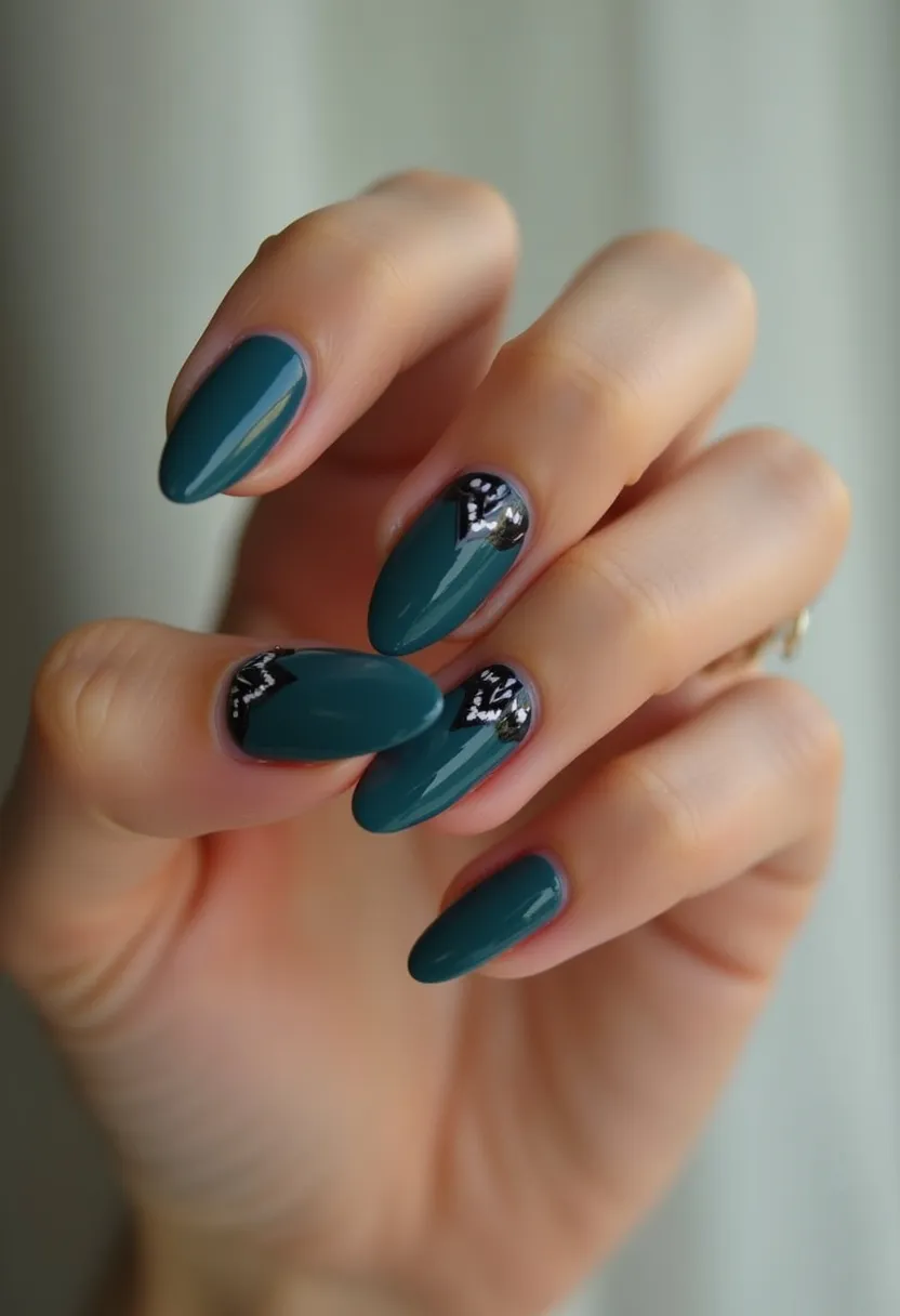 The nail design features a sleek and elegant palette dominated by a rich, forest green color. The nails are shaped in a pointed almond style, adding to their sophisticated and chic look. The ring and middle fingernails have intricate black triangular tips adorned with delicate white floral patterns, adding a touch of contrast and intricacy. This manicure appears to be done using gel polish, providing a glossy and smooth finish that enhances the vibrant colors and fine details. The design embodies a blend of minimalism and subtle artistry, making it suitable for both everyday wear and special occasions, particularly in autumn due to its deep, earthy color theme.