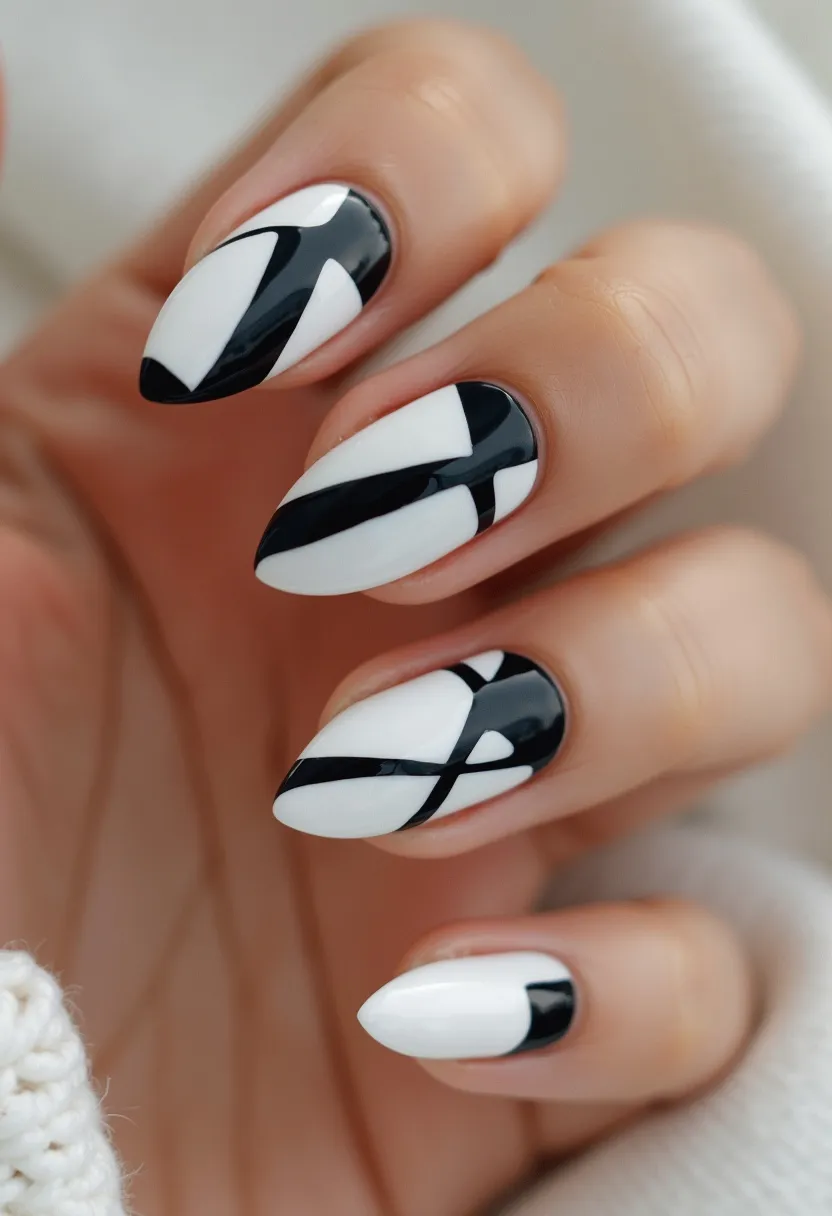 The nail design showcases a modern and stylish black and white palette, providing a classic yet bold contrast. The nails are shaped into a pointed almond form, giving a sleek and elegant look. The intricate pattern consists of geometric and abstract black lines that intersect and overlay the white base, creating a visually striking and dynamic effect. The nail treatment appears to be gel, evident from the high gloss finish and smooth texture. This design is versatile, suitable for various occasions but particularly fitting for formal events or sophisticated settings due to its monochromatic elegance and refined appearance.