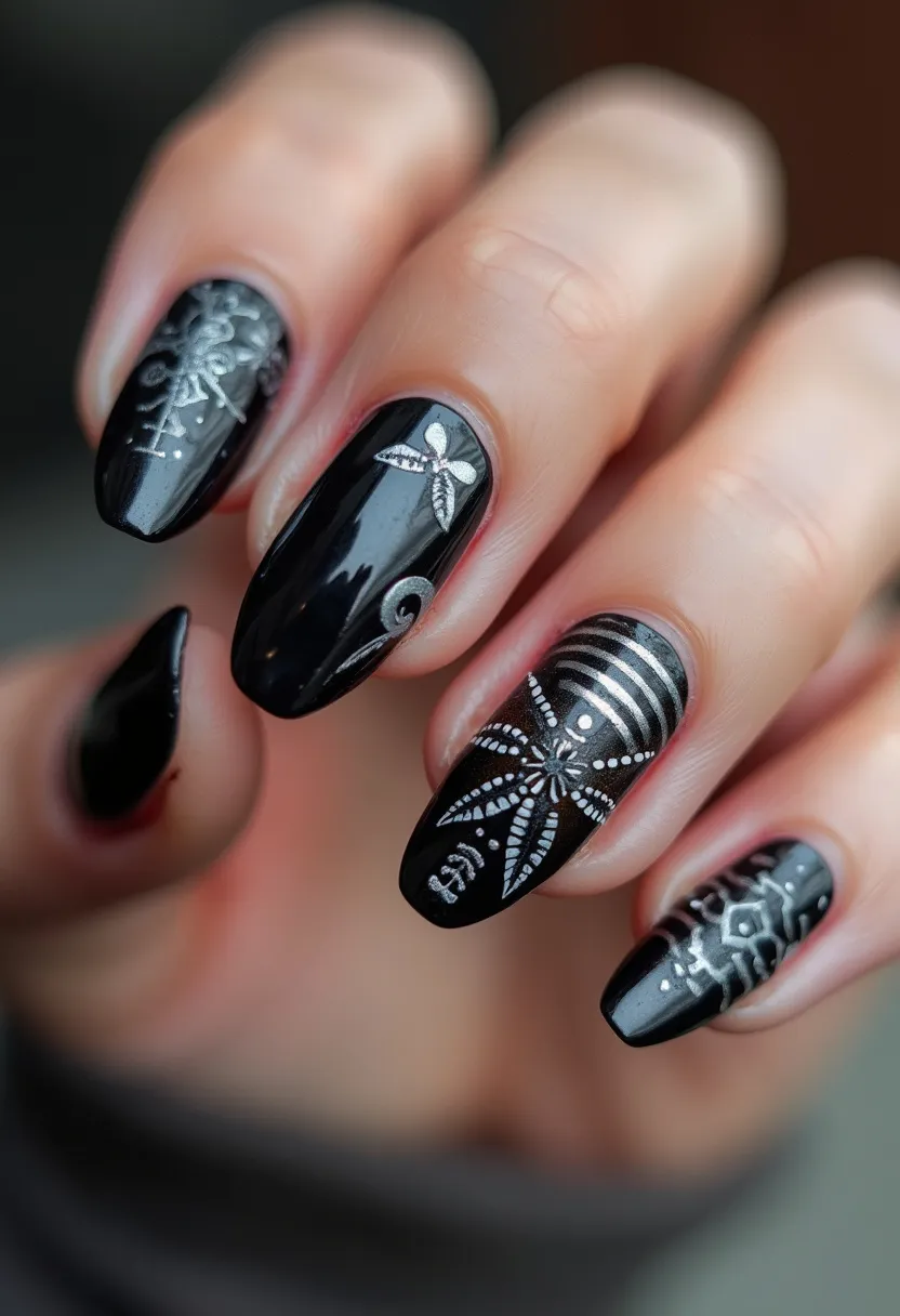 The nail design features a striking black color palette with intricate silver and white detailed patterns. The nails are almond-shaped and exhibit a smooth, glossy finish indicative of a gel or shellac treatment. The decorative elements include delicate, botanical-inspired patterns such as leaves, snowflakes, and floral motifs, prominently displayed on three nails. A unique aspect is the inclusion of horizontal stripes and dot patterns, adding a touch of geometric contrast to the design. This nail art could be suitable for seasonal themes like winter or special occasions that require an elegant and refined look.