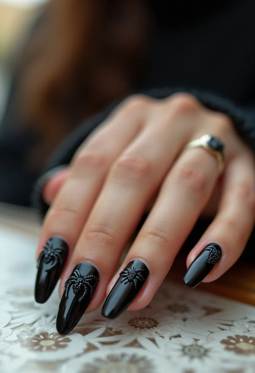 The nail design features a glossy black color palette that covers the entirety of the long, almond-shaped nails. The nails are intricately decorated with 3D black spider patterns on each nail, adding a spooky and thematic touch appropriate for a Halloween or autumn season look. The treatment appears to be a gel manicure, providing a shiny and smooth finish with sturdy durability. Each nail showcases a raised, detailed spider, enhancing the eerie vibe and suggesting a design tailored for a seasonal celebration or special themed occasion. The combination of the glossy black base and textured decorations creates a striking contrast and visual interest.