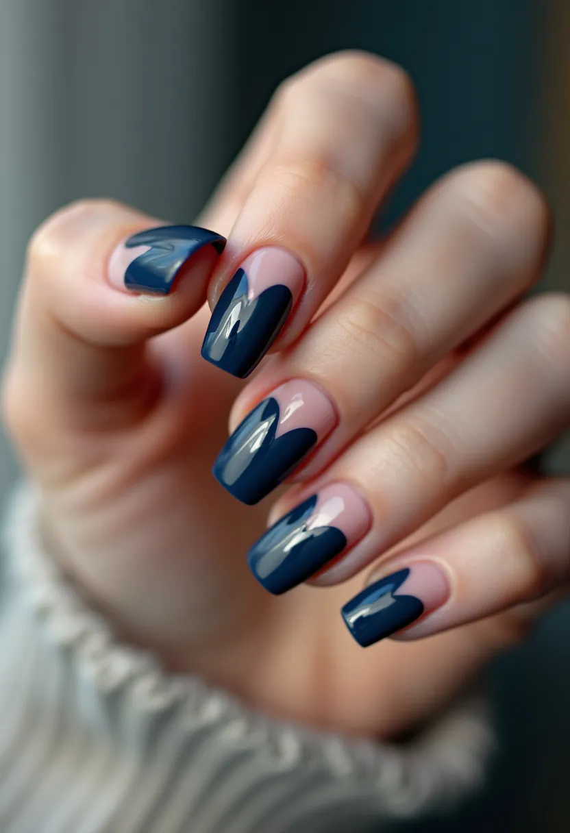 The nail design features a striking color palette with a deep navy blue and a natural, light pink base. The nails are almond-shaped, contributing to an elegant and refined look. The design includes intricate navy blue patterns that vary on each nail, creating a unique and cohesive style. The manicure appears to be a gel treatment, as suggested by the glossy finish and smooth application. This nail art is versatile, making it suitable for both everyday wear and special occasions, with its sophisticated and modern aesthetic. The design's clean lines and rich color choice might also make it a great option for a winter or evening event, offering a chic and polished appearance.