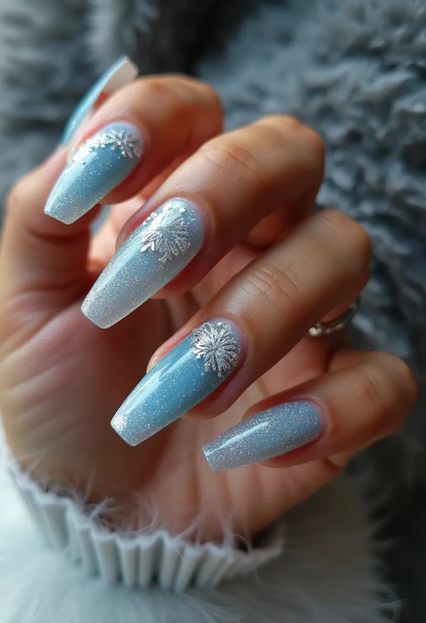 The nail design features a wintry theme with a cool-toned color palette primarily consisting of a shimmering light blue. The nails are long and shaped into a coffin or ballerina style, providing a spacious canvas for the design elements. Each nail is painted with a gradient effect or possibly an evenly distributed glitter polish, giving the nails a frosty, ethereal look. Intricate white and silver snowflake decals are delicately placed near the base of each nail, enhancing the wintery theme. The glossy, smooth finish suggests that a gel nail treatment was used, adding durability and shine to the overall look. This nail design is ideal for seasonal celebrations, particularly during the winter months or holiday season.