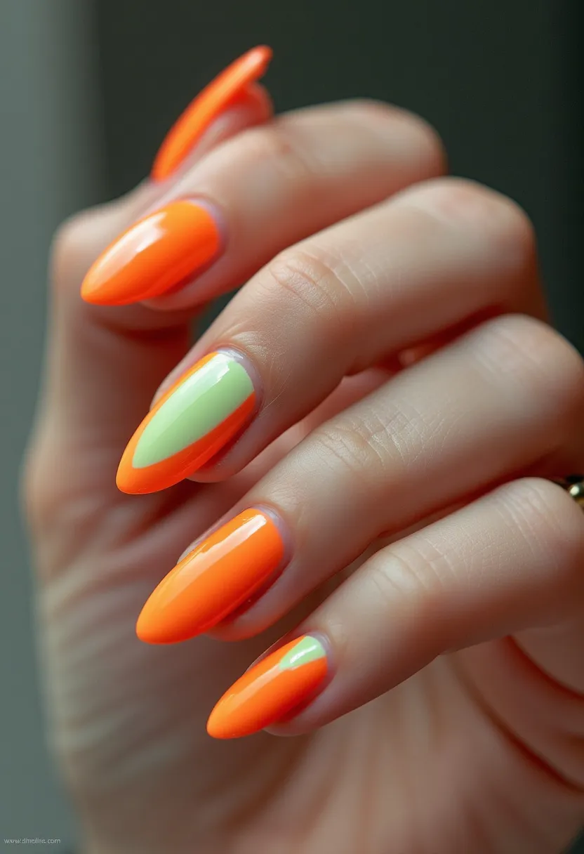 The nail design features a vibrant and bold color palette primarily consisting of a bright orange hue. The nails are almond-shaped, providing a chic and elegant look. Among the nails, one stands out with a unique pattern, displaying a soft green color split down the center horizontally bordered by the dominant orange. The high-gloss finish hints at a gel or shellac treatment, ensuring durability and a sleek appearance. This striking combination of colors and design elements suggests a fun, summery theme, perfect for making a statement during the warmer months or at lively gatherings. The overall design exudes a playful and energetic vibe, ideal for those looking to showcase their vibrant personality through their nail art.