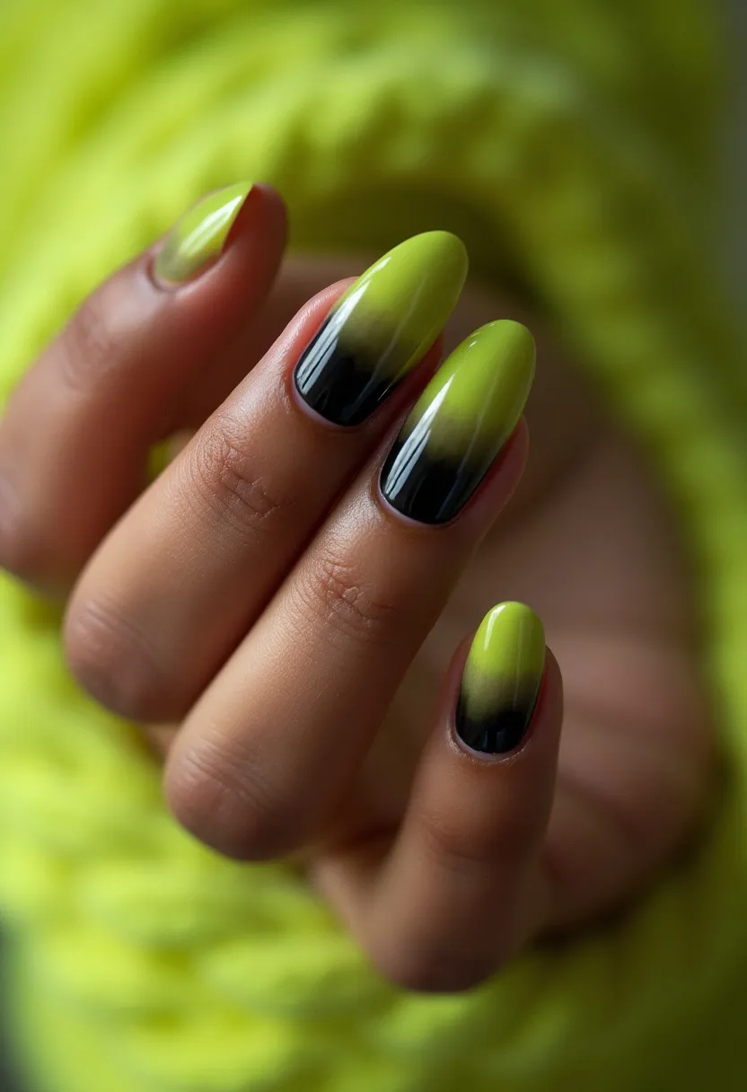 The nail design features an eye-catching color palette that transitions from a striking lime green at the cuticles to a deep, rich black at the tips, creating an ombre effect. The nails are almond-shaped, providing a sleek and elegant appearance. The intricate gradient pattern on each nail gives a polished and modern look, focusing on a seamless blend of colors. This type of nail treatment is likely a gel manicure, known for its glossy finish and durability. The unique green-to-black ombre design may be suitable for fall or Halloween, offering a subtly dramatic yet sophisticated style.