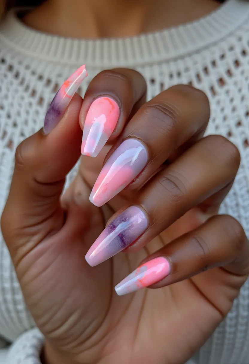 The nail design showcases a vibrant and artistic palette, featuring a blend of soft pastel pink, coral, and hints of purple and white hues, creating a watercolor effect. The nails are long and shaped into a sleek stiletto form. The design includes intricate, fluid, and marbled patterns, imparting a dynamic look that is likely achieved through a gel treatment given the glossy finish. This style exudes a fresh and playful vibe, suitable for spring or summer seasons, making it ideal for occasions that call for an elegant yet lively appearance such as weddings, parties, or vacations.