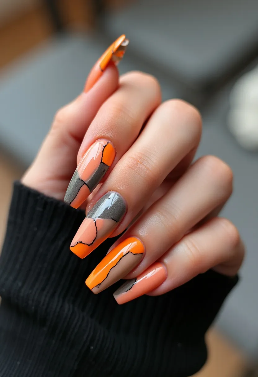 The nail design features long, coffin-shaped nails with a striking color palette of orange and gray. The nails display an abstract, geometric pattern where the colors are divided into different sections by thin black lines, creating a modern, fragmented look. The treatment appears to be gel due to the high-shine finish and seamless blending of colors. The bold and vibrant tones suggest a seasonal theme appropriate for autumn, making it a perfect design for fall festivities or Halloween. The meticulous detail of the dividing lines adds an intricate touch, enhancing the contemporary and stylish flair of the nail art.