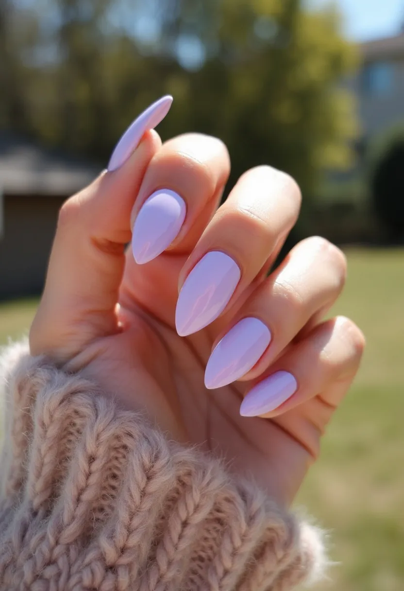 The  nail  design  features  a  pink  nail  color  palette,  with  the  nails  being  long  and  pointed. The  nails  are  simply  painted  with  a  single  shade  of  pink,  giving  them  a  clean  and  elegant  appearance.