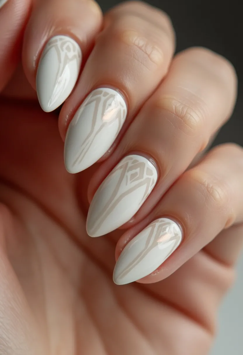 The nail design features a stiletto shape, characterized by long, pointed tips. The color palette is a sophisticated mix of soft white and cream hues, providing an elegant and understated look. The nails are adorned with intricate geometric patterns that incorporate lines and diamond shapes, adding a touch of artistry and visual interest. The finish appears to be achieved with a gel treatment, giving the nails a glossy and polished appearance. The design has a minimalist yet contemporary feel, suitable for special occasions such as weddings or formal events, as well as making a chic statement for the winter season.