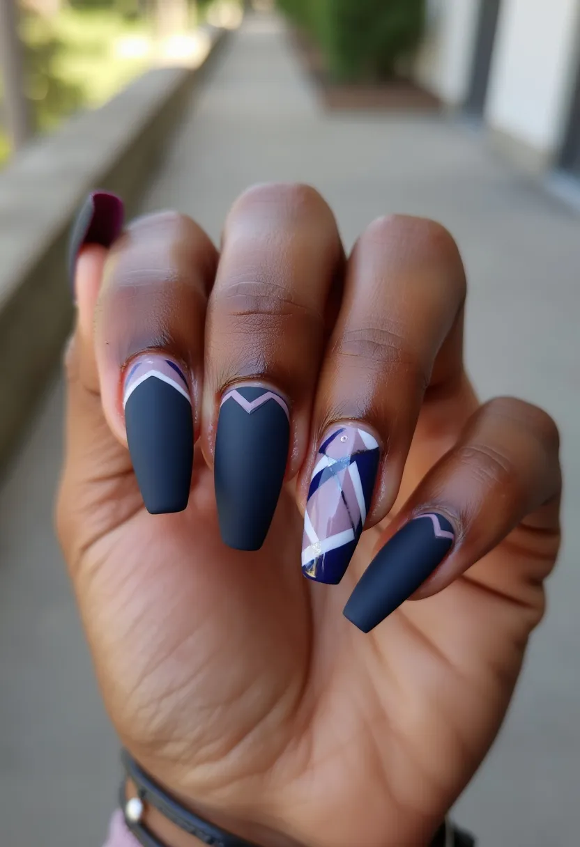 The nail design features a matte navy color palette with elegant touches of nude and white accents. The nails are long with a coffin shape, creating a sophisticated appearance. The predominant design includes geometric patterns with nude triangular sections outlined in white, giving a chic and modern look. The ring finger has a more intricate design, incorporating geometric shapes outlined in white and tinted with translucent nude, resembling a stained glass effect. This nail design likely utilizes gel polish, known for its glossy and durable finish, even when matte. The overall theme is elegant and versatile, making it suitable for both special occasions and everyday wear.