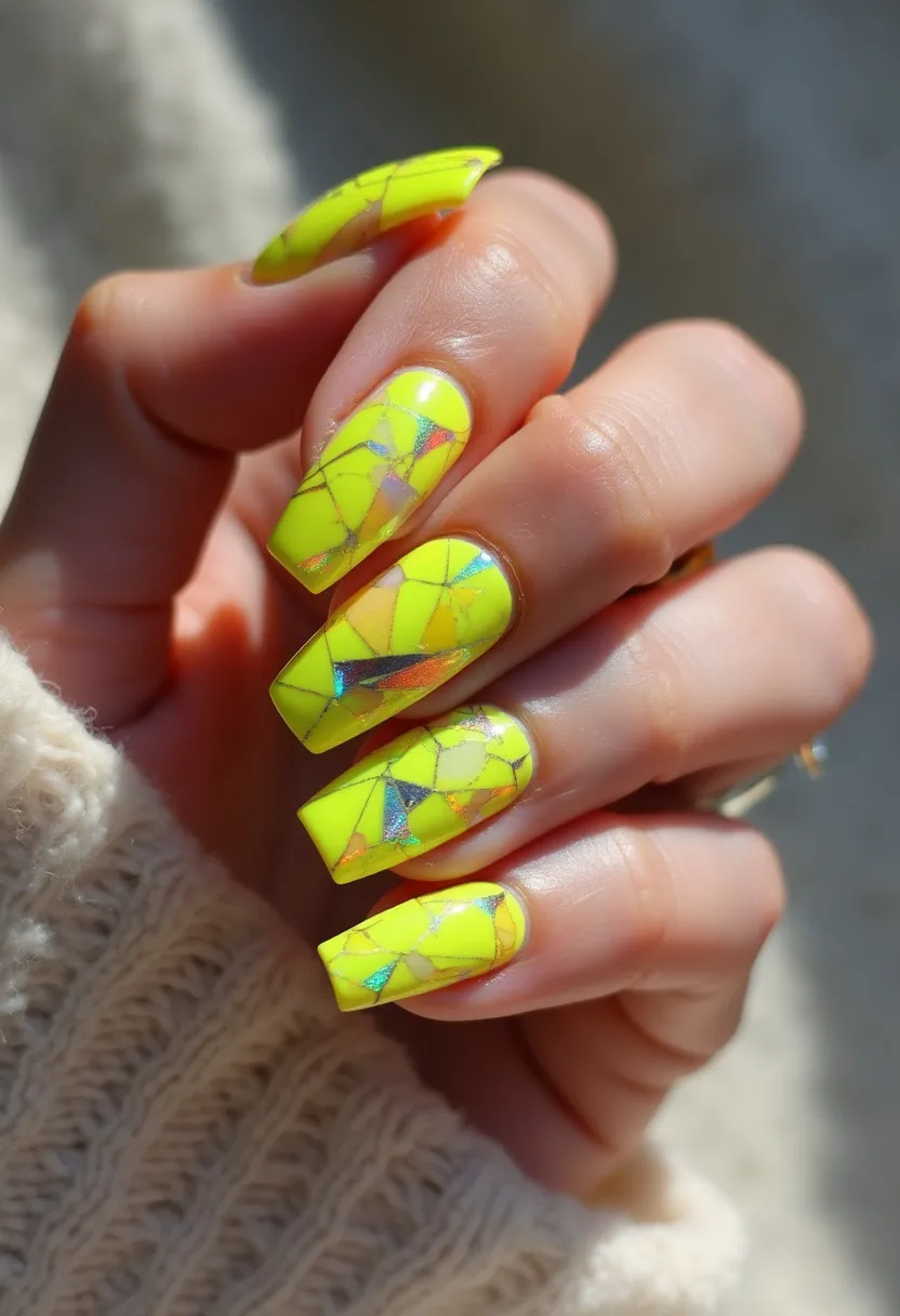 The nail design features a vibrant, neon yellow color palette that vividly stands out. The nails are shaped with a medium length square tip, providing a modern and clean silhouette. An intricate pattern resembling a mosaic or stained glass effect is meticulously applied on each nail, created with shards of holographic and iridescent materials bordered by fine black lines. This design is likely achieved using gel polish, given the glossy finish and the precision of the pattern. The colorful, reflective elements suggest a playful, lively feel, possibly suited for summer or festive occasions. This unique and bold design is eye-catching and artistic, making a statement with its bright, cheerful hues and detailed decorations.