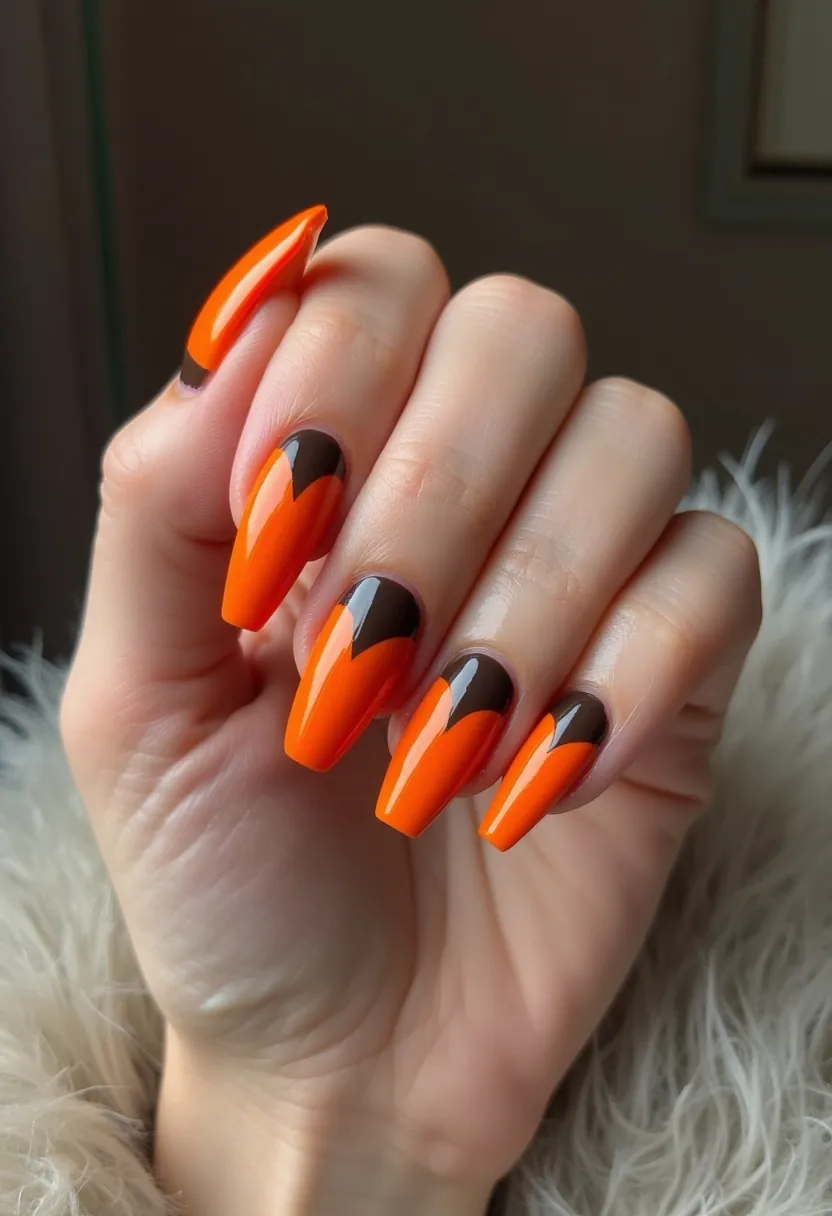 The nail design showcases a vibrant color palette primarily featuring a striking combination of orange and brown shades. The nails are shaped in a long, tapered coffin style, offering a sleek and elongated appearance. The design includes intricate curved brown patterns near the cuticles, creating a dynamic contrast against the vivid orange base. This nail treatment appears to be a gel application, evident from the high-gloss finish and smooth surface. The color choices and design elements suggest a seasonal theme, likely suitable for autumn or Halloween, drawing inspiration from the warm, earthy tones typical of this time of year.