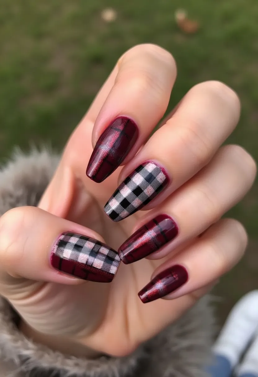 The nail design features a striking color palette dominated by rich burgundy and classic black and white. The nails are shaped in a medium-length tapered square style. An intricate plaid pattern showcases black and white checkered designs accented with thin red lines, creating a visually appealing contrast against the deep burgundy base. The treatment appears to be done using the gel method, providing a glossy and smooth finish. This design exudes a chic, fall or winter vibe, making it stylishly appropriate for seasonal outings or festive celebrations, with the plaid pattern evoking a cozy, timeless fashion statement.