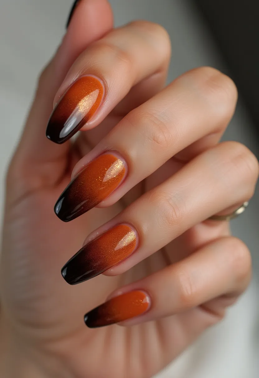 The nail design features an eye-catching gradient effect transitioning from a rich, shimmering burnt orange at the base to a deep, glossy black at the tips. The nails are shaped in a refined almond style, which adds elegance and elongation to the fingers. The treatment appears to be gel polish, notable for its smooth, glossy finish and the depth of color it provides. The combination of orange and black evokes an autumnal or Halloween theme, suitable for seasonal celebrations or festive occasions. The delicate shimmer within the orange polish offers a sophisticated touch, making the nails appear more vibrant and dynamic under light.