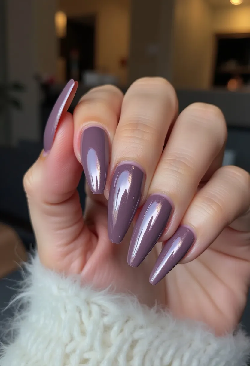 The nails are elegantly shaped in an almond style and painted with a smooth, glossy finish. The color palette consists of a sophisticated mauve shade that exudes a sense of chic simplicity. The high-gloss shine suggests a gel or shellac treatment, providing durability and a mirror-like sheen. There are no intricate patterns or additional decorations, allowing the rich, muted color to stand out on its own. This design is versatile, suitable for any season, and perfect for both everyday wear and special occasions, offering a refined and elegant look.