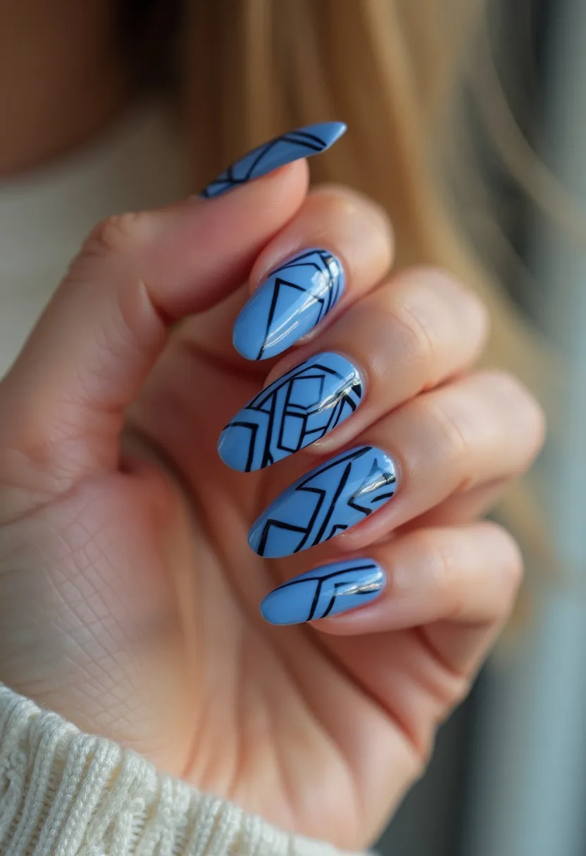 The nail design showcases a refined color palette dominated by a soft pastel blue base. The nails are elongated and almond-shaped, contributing to an elegant and sophisticated look. The intricate patterns feature geometric black lines that intersect and create an eye-catching abstract design on each nail. This detail suggests a modern and artistic aesthetic, likely achieved using gel polish due to the glossy and smooth finish that is characteristic of this type of treatment. The design is versatile and suitable for both everyday wear and special occasions, making it a fashionable choice that transcends seasonal trends.