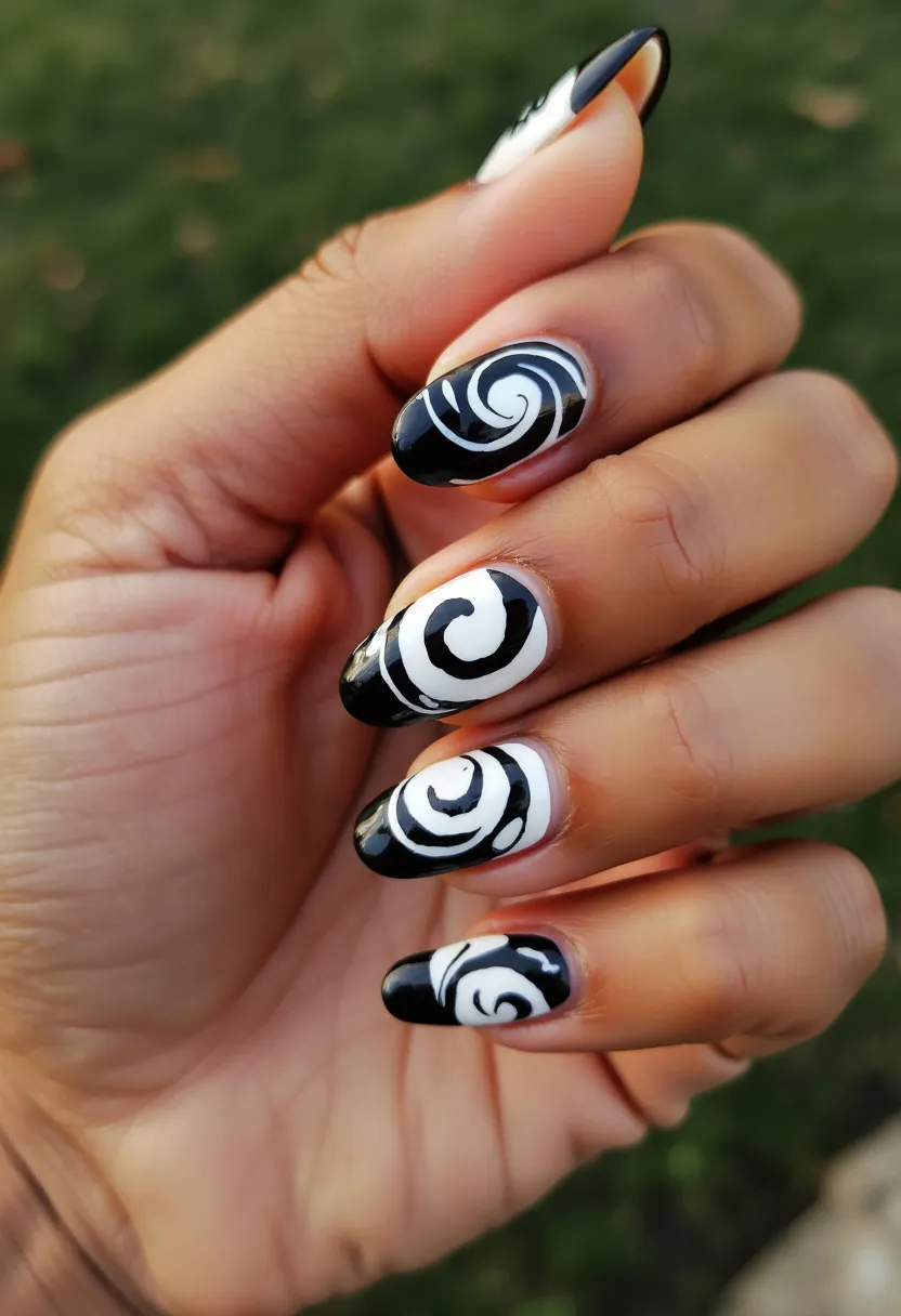 This nail design features a black and white color palette, showcasing a bold contrast that highlights the intricate swirl patterns on each nail. The nails are medium length and almond-shaped, giving them an elegant and sophisticated appearance. The black and white swirls are artistically placed, creating a dynamic and eye-catching design. The nail treatment appears to be gel, as evidenced by the smooth, glossy finish. This design is versatile and can be suitable for various occasions, lending itself well to both casual and formal events, and the monochromatic color scheme can be fitting for any season.