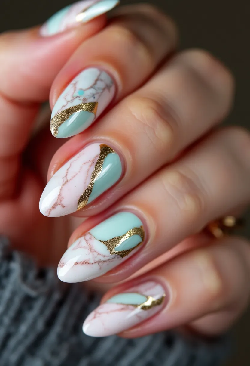 The nail design features an elegant and sophisticated combination of pastel and metallic hues. The color palette prominently includes a soft mint green and a white base with light pink marbled veins, highlighted with striking gold foil accents. The nails are almond-shaped, giving a refined and elongating effect to the fingers. The intricate pattern includes marbling that mimics natural stone, complemented by shimmering gold details that add a luxurious touch. This design appears to use gel techniques to achieve a high-shine, smooth finish, suggesting durability and a long-lasting wear. The overall look is versatile, making it suitable for both special occasions and a polished, everyday style.