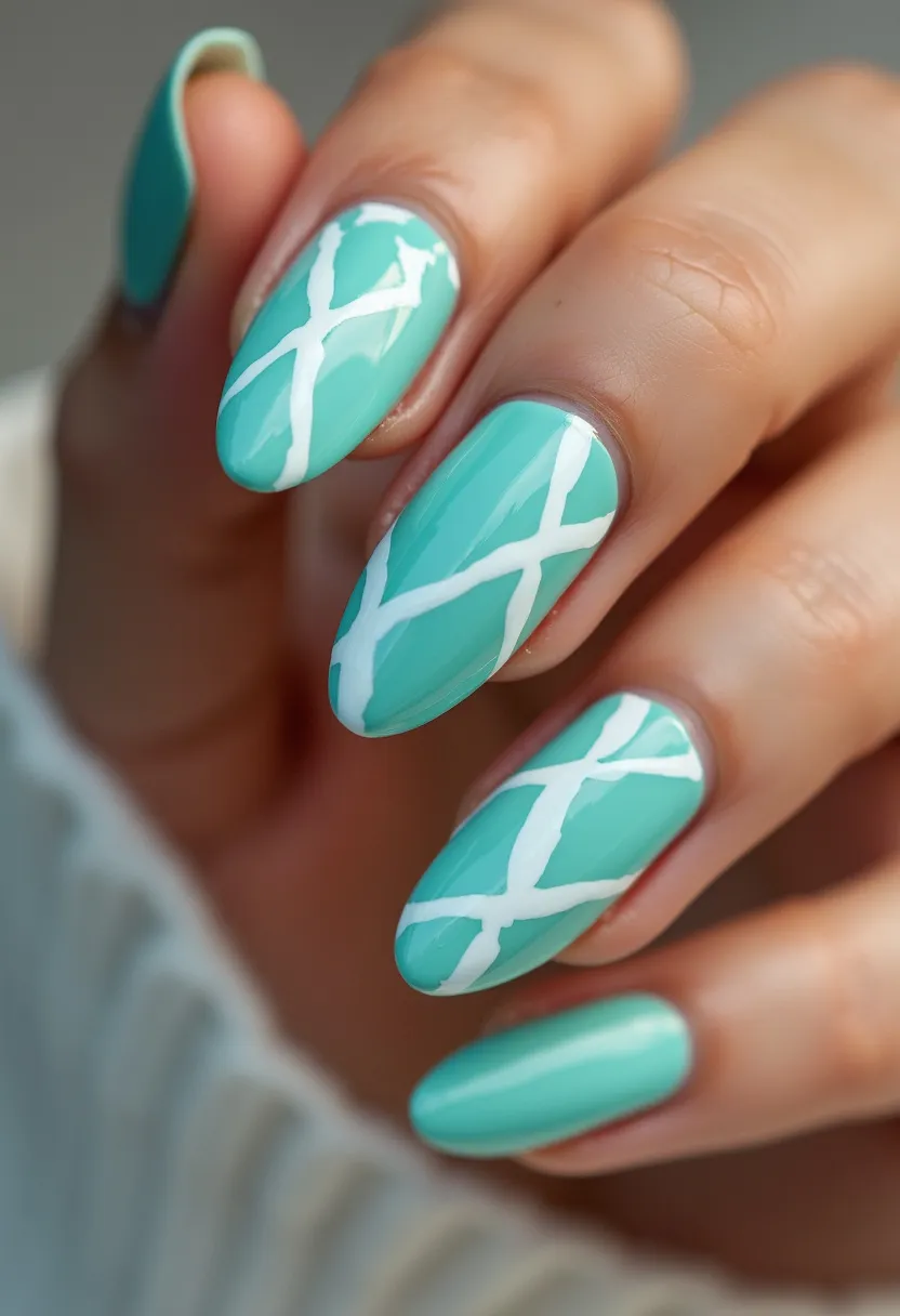 The nail design features a vibrant aqua blue color as the primary palette, with an accent of white geometric lines crossing over the nails. The nails are shaped in a long almond form, enhancing the elegant and elongated look of the fingers. The intricate pattern consists of diagonal white lines that intersect each other in a grid-like fashion, creating a striking, modern art effect. The glossy finish suggests a gel or shellac treatment, giving the nails a smooth and shiny appearance. The fresh, vivid colors and contemporary design make this manicure an excellent choice for spring or summer seasons, adding a playful and trendy flair to any outfit.