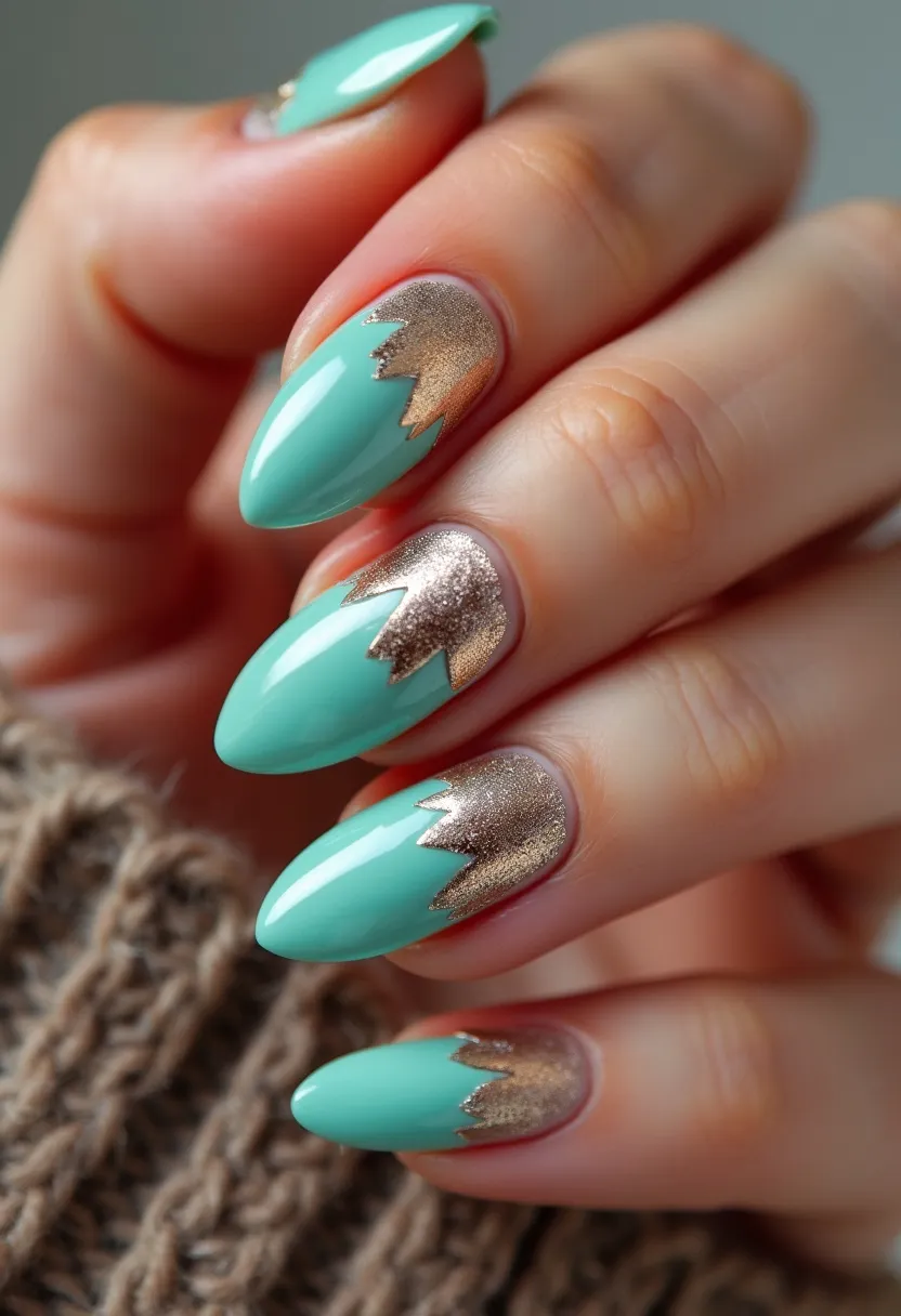 The nail design features a striking color palette of mint green and metallic gold. The nails are shaped in a long, almond style, providing an elegant and elongated look to the fingers. Each nail showcases dual-colored detailing, with the base portion near the cuticle being a shimmering metallic gold that transitions sharply into a solid mint green towards the tips in a jagged, crown-like pattern. This intricate design gives a trendy and sophisticated appeal, and the glossy finish suggests the use of gel or shellac treatment, ensuring durability and a high-shine effect. The unique combination of colors and patterns is versatile enough for various seasons but especially fitting for spring or summer celebrations.